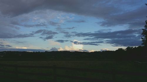 Scenic view of landscape against cloudy sky