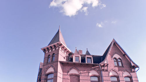 Low angle view of building against blue sky