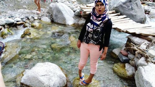 Woman standing in lake