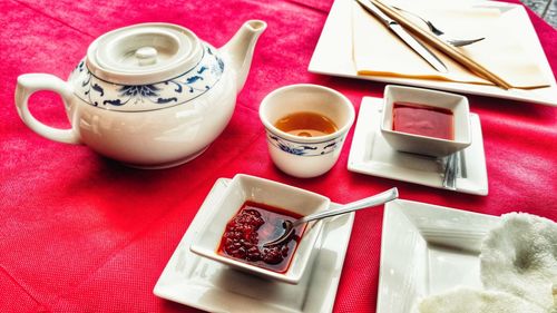 High angle view of tea with soup served on table