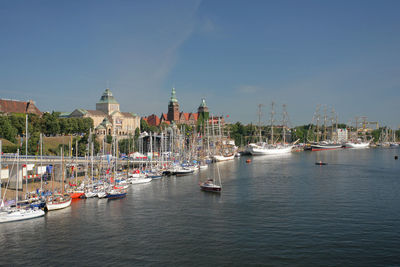 Boats moored at harbor