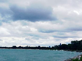 Scenic view of sea against cloudy sky