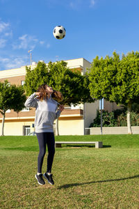 Low angle view of soccer ball on field against sky