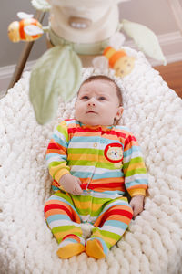 High angle view of cute baby toy on bed at home