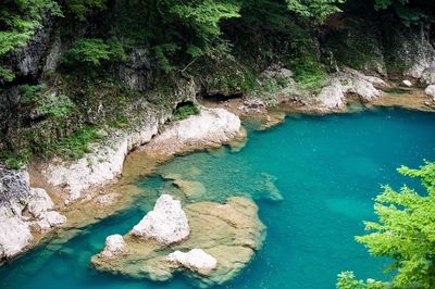 High angle view of rocks by sea