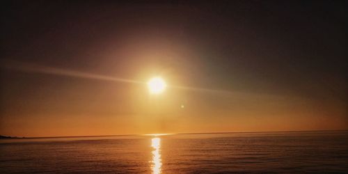 Scenic view of sea against sky at sunset