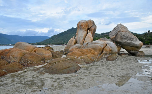 Scenic view of mountains against cloudy sky