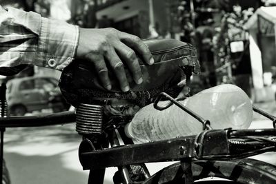 Close-up of man hand on motorcycle