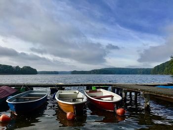 Boats in sea against sky