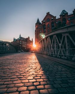 View of bridge in city at sunset