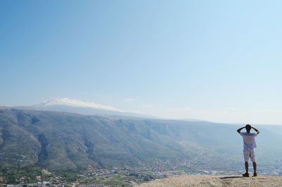 Woman standing on mountain landscape