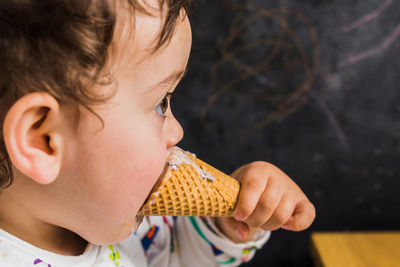 Close-up of girl eating ice cream
