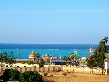 Scenic view of sea against clear blue sky