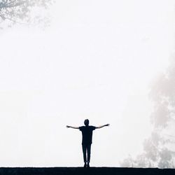 Low angle view of woman jumping