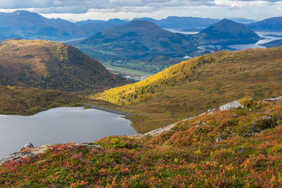 Scenic view of lake amidst mountains during autumn