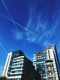 Low angle view of buildings against blue sky