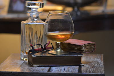 Close-up of wine glasses on table