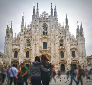 Group of people in front of historical building