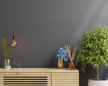 Wooden cabinet mockup in modern empty room,dark wall.3d rendering