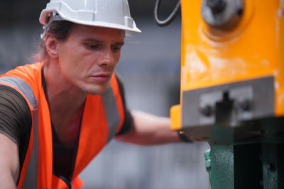 Portrait of engineer working in factory