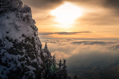 Scenic view of snow mountains against sky during sunset