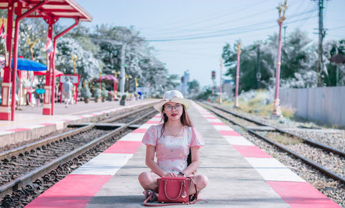 Portrait of woman on railroad station