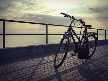 Reflection of clouds in sea at sunset