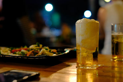 Close-up of beer glass on table