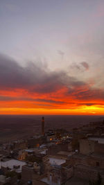 High angle view of buildings against sky during sunset