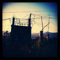 Built structure on field against sky