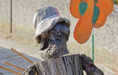 Close-up of sculpture on wooden post