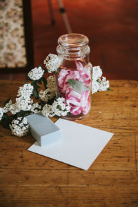 Close-up of plants and jar on table