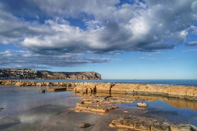 Scenic view of beach against sky