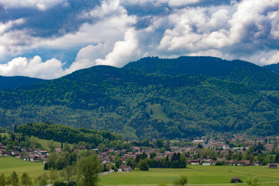 Scenic view of landscape and mountains against sky