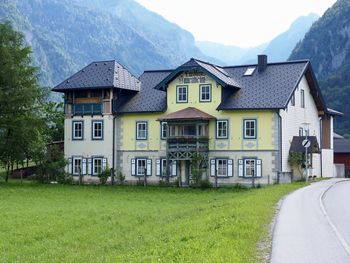 Houses by road in city