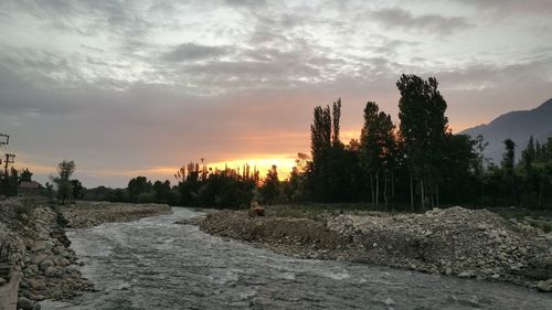 Scenic view of landscape against cloudy sky