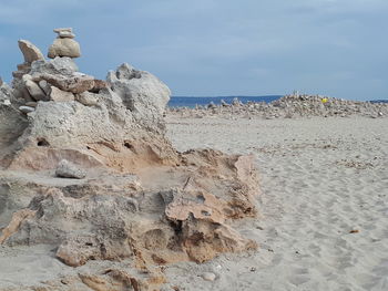 Rocks on shore against sky