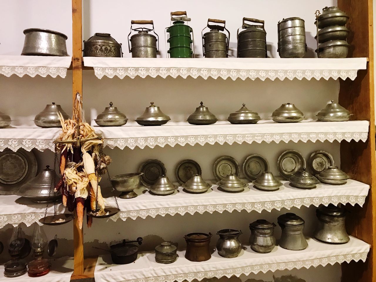 CLOSE-UP OF WINE BOTTLES ON SHELF