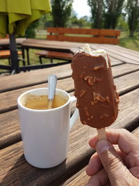 Close-up of hand holding ice cream