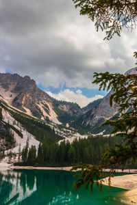 Scenic view of lake and mountains against sky