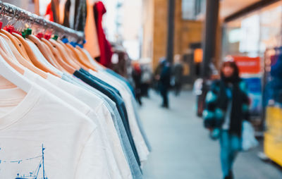 Close-up of clothes hanging in store