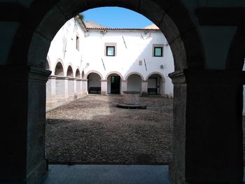 Historic building seen through colonnade