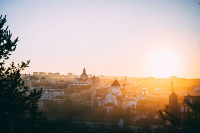 View of buildings in city against clear sky