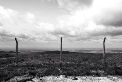 Scenic view of landscape against cloudy sky
