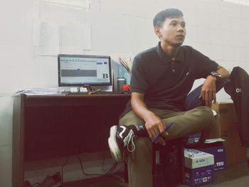 Portrait of young man looking away