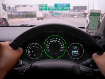 Gauges seen through steering wheel in car