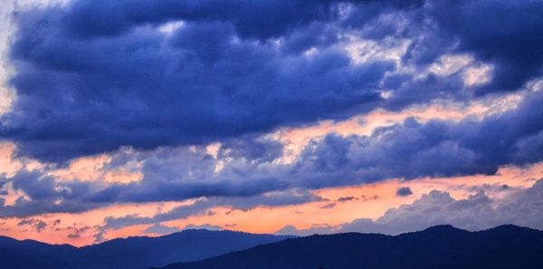 Low angle view of dramatic sky during sunset