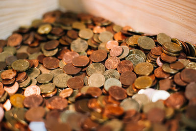 High angle view of coins on table