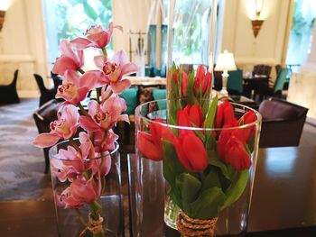 Close-up of red flower vase on table