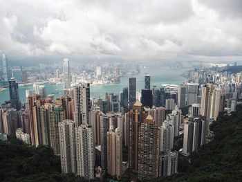 High angle view of buildings in city against sky